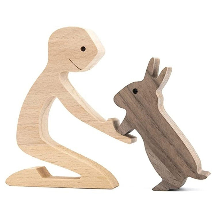 Glow Supply Sculpture en bois d'une personne agenouillée interagissant avec un lapin, artisanat fait main, décoration intérieure.